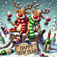 two reindeers sitting on top of a log with wine glasses and bottles in the snow