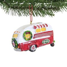 an ornament shaped like a camper is hanging on a christmas tree branch