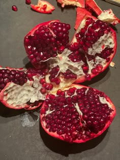 the pomegranates are cut in half and ready to be used as garnishes