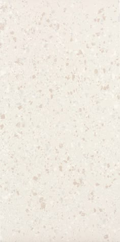 an image of a white and beige wallpaper with speckles on the surface