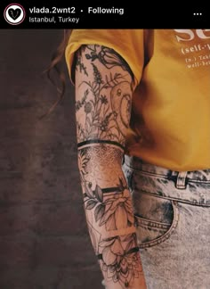 a person with tattoos on their arms and arm