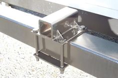 a metal bench with two brackets on it