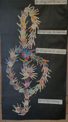 a bulletin board with hand prints on it