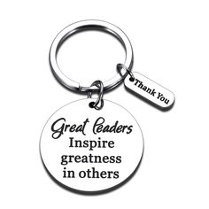 a keychain with the words great leaders inspire greatness in others on it