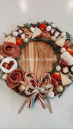 a christmas wreath with candy canes and candies