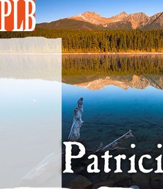 a lake with mountains in the background and an advertisement for plb's new website