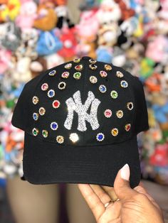 Viral Trend Bling NY, Atl, or LA hat.  Adjustable Velcro fit.  Bling Logo makes this hat stand out above the rest! Fall is here and this hat is going to accent whatever outfit you decide to wear! Very Blingy, Very Cutesy, Very Fashionable it's giving OH THIS GIRL GOT STYLE STYLE If you want to request another color hat please feel free to message me and I got you covered!  Make sure to follow my Instagram and tag me when you post this piece  @ Riris.Party Bedazzled Hats Baseball Caps, Bedazzled Hat, Bedazzling Ideas, Girl Updo, Diy Hats, Rhinestone Hat, Custom Fitted Hats, Swag Hats, Ny Hat