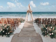 an outdoor ceremony set up on the beach