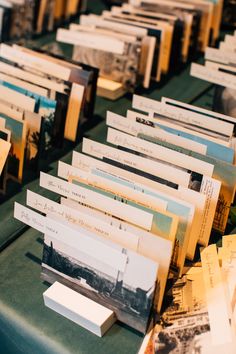 there are many books that are lined up on the table with each one's name