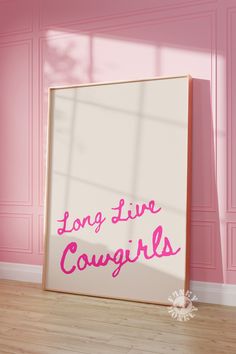 a pink room with a white framed sign that says, long live cougins