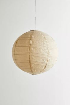 a round paper lantern hanging from a string