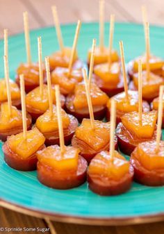 small appetizers with toothpicks on a blue plate