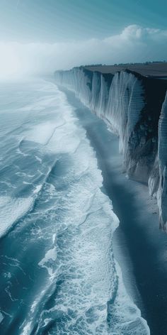 the cliffs are very high on the water and they look to be made of ice