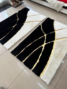 two black and white rugs sitting on the floor