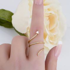 Make a statement by wearing our Women’s Pavé Crystal Snake Wrap Ring. It combines glam with chic to produce an eye-catching piece. Pavé crystals line the front of the wrap, finishing with a bold teardrop crystal the makes up the head of the snake. Color: Gold & Silver Ring Size: Adjustable (Fits sizes 5-8) Material: Cubic Zirconia & 14k Gold plated or Silver plated on brass, topped off with clear coating for an extra layer of durability. Snake Ring Gold, Snake Ring Silver, Pearl Jewelry Necklace, Cute Gift Boxes, Snake Design, Wrap Ring, Snake Ring, The Snake, Local Business