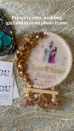 a couple's wedding photo on a brochure next to some beads and jewelry