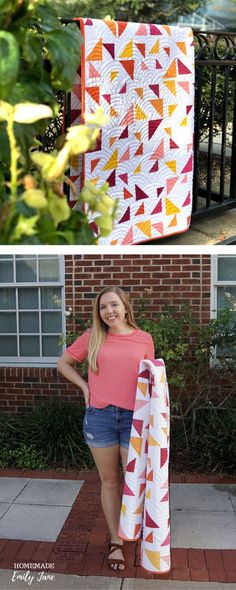 a woman is standing next to a quilt