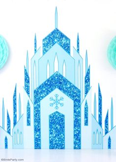 a paper cut out of a church with snowflakes on it