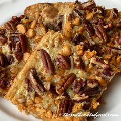 three pieces of pecan bread on a white plate