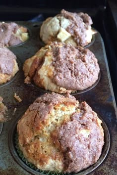 freshly baked muffins sitting in a muffin tin