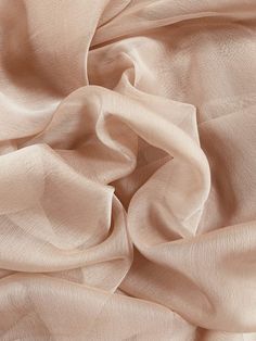 a close up view of the fabric on a bed sheet that has been made to look like silk