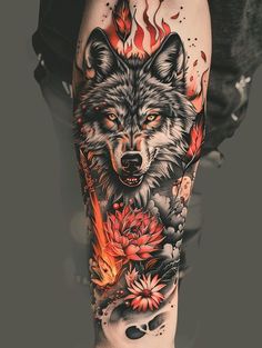 a man's leg with a wolf and flowers tattoo on it