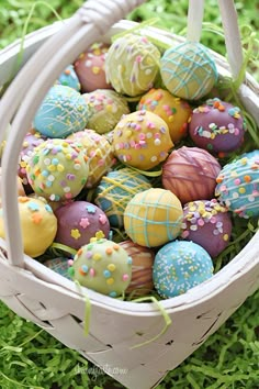 there are many different types of decorated eggs in the basket