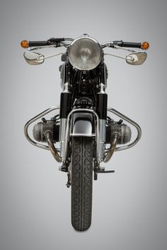 the front end of a motorcycle on a gray background