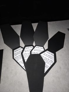 several pieces of paper cut out to look like an origami man's head