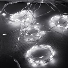 some lights that are on top of a sheet of paper with string lights around them