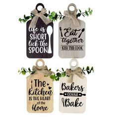 three wooden tags with sayings on them and some greenery hanging from the handles