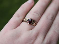 Adorn your finger with a unique and elegant touch with this stunning snail and flower engagement ring set featuring a mesmerizing garnet stone set in luxurious 14k gold. The intricate details of the snail and flower design beautifully complement the natural beauty of the garnet stone, creating a one-of-a-kind piece that symbolizes love and connection. Perfect for nature lovers and those seeking a truly special and meaningful engagement ring, this piece is sure to be cherished for a lifetime. Each piece of jewelry is created using a digital sculpting program to sculpt the snail, flower, and branch texture of the mounting, then the piece of jewelry is brought to life through the age old method of lost wax casting. After casting each ring is hand finished, including texturing, polishing, and Snail Ring, Flower Engagement Ring Set, Elven Ring, Digital Sculpting, Nature Inspired Rings, Garnet And Gold, Garnet Stone, Matching Band, Bridal Sets