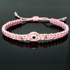 Hand-Made Pink String Bracelet With An Evil Eye For Wrist Sizes From 6 To 9 In. These Bracelets Are Worn To Attract Good Fortune, Bring A Good Mood And To Ward Off Bad Vibes. Evil Eye Bracelet Braided, Pink Adjustable Bracelet Jewelry, Pink Resizable Braided Bracelet, Adjustable Pink Evil Eye Bracelet, Elegant Adjustable Pink Friendship Bracelets, Elegant Pink Braided Bracelets As Gift, Elegant Pink Braided Bracelet Gift, Alpha Knot, Evil Eye Meaning