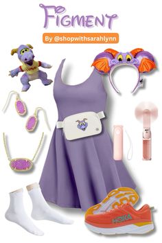 a purple dress and accessories are arranged in the shape of an elephant's head