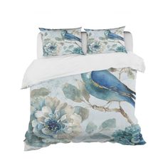 a blue bird sitting on top of a bed next to white sheets and pillow cases