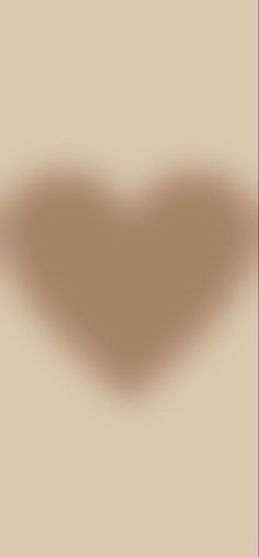 the shadow of a heart on a beige background