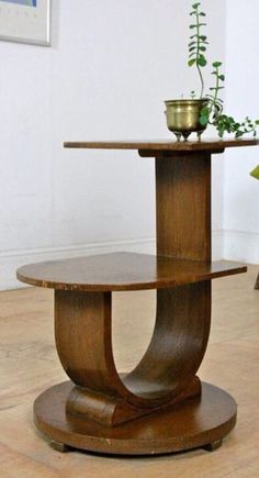 a wooden table sitting on top of a hard wood floor