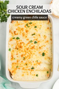 a white casserole dish filled with chicken enchiladas and topped with cilantro