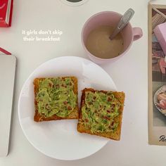 two pieces of toast with guacamole on them and a cup of coffee