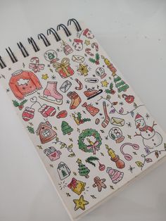 a notebook with christmas stickers on it