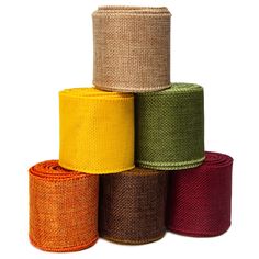 five rolls of colored burlock on top of each other in different colors and sizes