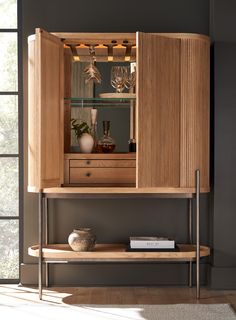 a wooden cabinet with wine glasses on it