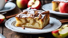 there is a piece of cake on the plate with apples and cinnamon sticks around it