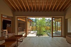 an open living room with wooden floors and sliding glass doors