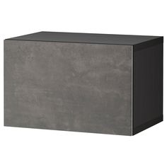 a large gray box sitting on top of a white floor