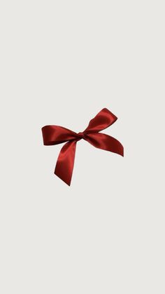 a red bow on a white background