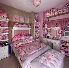 a bedroom decorated in pink and white with hello kitty decorations