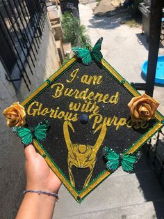 someone is holding up a graduation cap that says i am budded with giara's pure