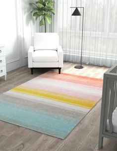 a baby's room with a crib, chair and rug in pastel colors