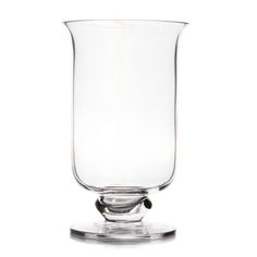 a clear glass vase sitting on top of a table